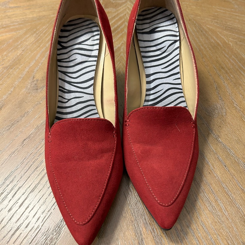 Red suede heeled shoes.